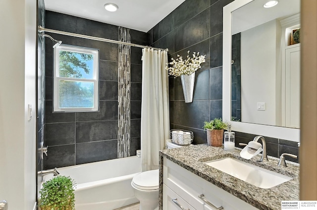 9903 Pasadena Ave, Omaha, NE 68124 - full bath featuring vanity, shower / bathtub combination with curtain, tile walls, and tasteful backsplash