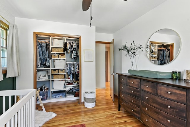 9903 Pasadena Ave, Omaha, NE 68124 - bedroom featuring light wood finished floors, a closet, and ceiling fan