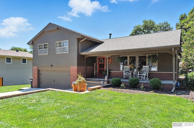 9903 Pasadena Ave, Omaha, NE 68124 - tri-level home with brick siding, a porch, an attached garage, and a front yard