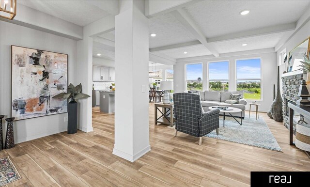 7409 N 176th Ave, Bennington, NE 68007 - living room with light wood-style floors, recessed lighting, beamed ceiling, and coffered ceiling