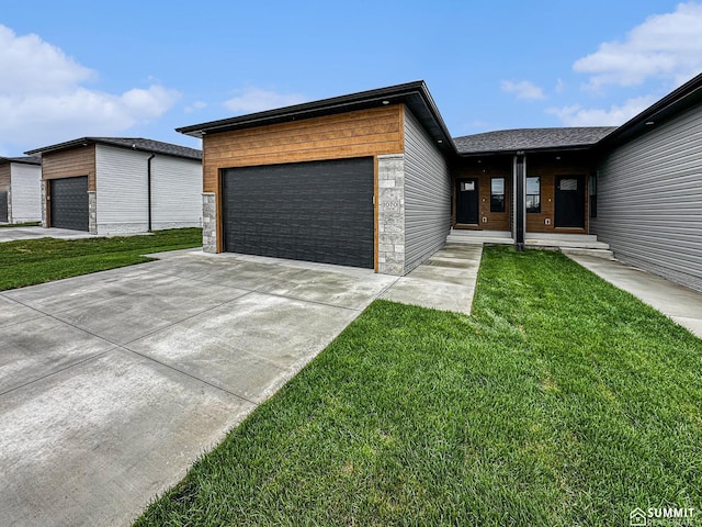 1070 Titan Dr, Hickman, NE 68372 - contemporary house with a front lawn and an attached garage