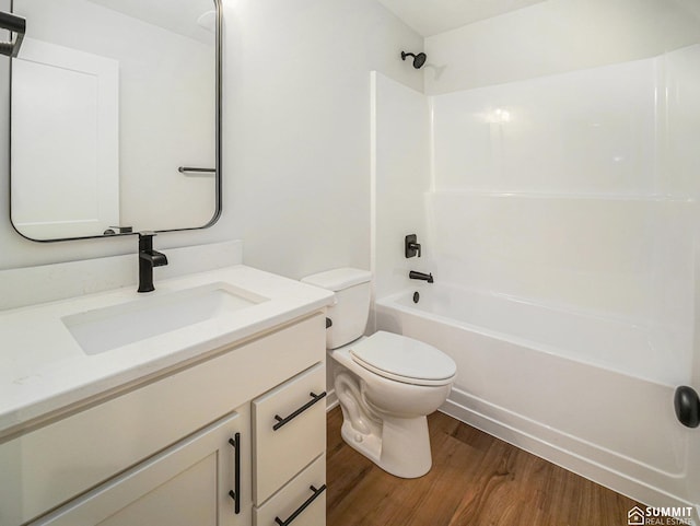 1070 Titan Dr, Hickman, NE 68372 - full bathroom featuring wood finished floors, vanity, and  shower combination
