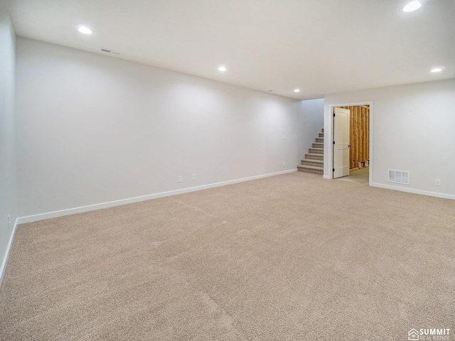1070 Titan Dr, Hickman, NE 68372 - finished basement with stairway, recessed lighting, and light carpet