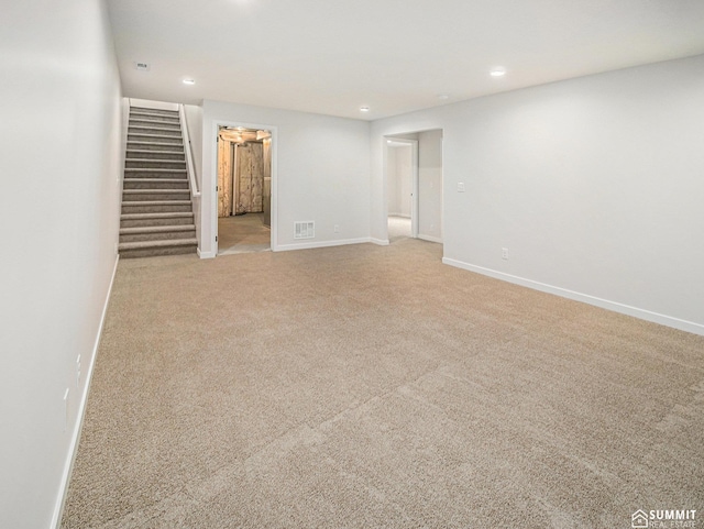 1070 Titan Dr, Hickman, NE 68372 - unfurnished room with light carpet, recessed lighting, and stairway
