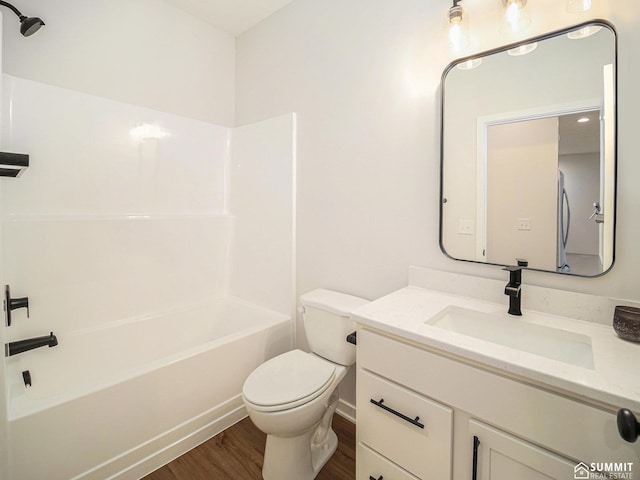 1070 Titan Dr, Hickman, NE 68372 - full bathroom with wood finished floors, vanity, and shower / washtub combination