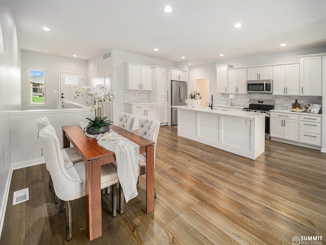 1070 Titan Dr, Hickman, NE 68372 - dining space featuring light wood-type flooring and recessed lighting