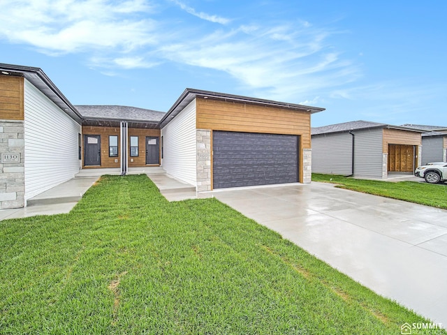 1120 Titan Dr, Hickman, NE 68372 - modern home featuring a front yard and stone siding