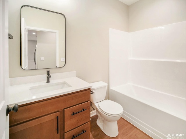 1120 Titan Dr, Hickman, NE 68372 - bathroom featuring vanity, wood finished floors, and washtub / shower combination