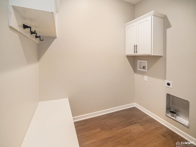 1130 Titan Dr, Hickman, NE 68372 - laundry area with dark wood-type flooring, washer hookup, electric dryer hookup, and cabinet space