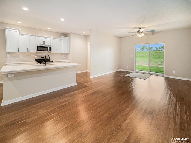1130 Titan Dr, Hickman, NE 68372 - unfurnished living room with ceiling fan, wood finished floors, and recessed lighting