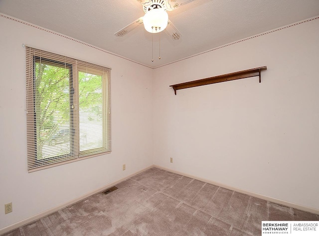 1502 Sunshine Blvd, Bellevue, NE 68123 - spare room featuring light colored carpet and a ceiling fan