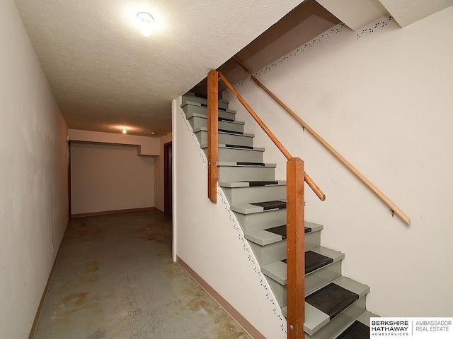 1502 Sunshine Blvd, Bellevue, NE 68123 - stairs featuring unfinished concrete floors and a textured ceiling