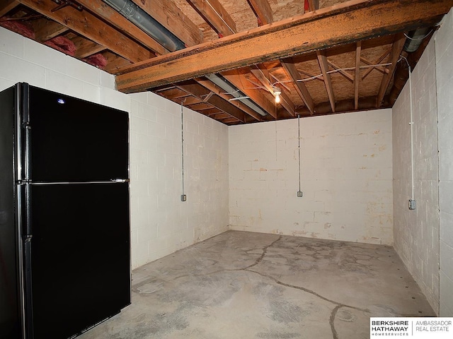 1502 Sunshine Blvd, Bellevue, NE 68123 - unfinished below grade area with freestanding refrigerator and concrete block wall