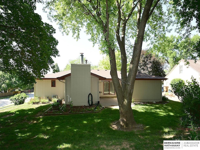 1502 Sunshine Blvd, Bellevue, NE 68123 - rear view of house with a yard