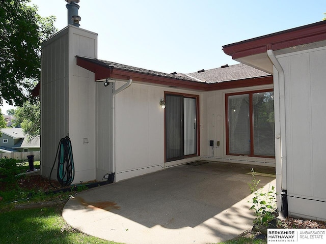 1502 Sunshine Blvd, Bellevue, NE 68123 - back of property featuring a patio area and a chimney