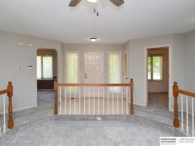 1502 Sunshine Blvd, Bellevue, NE 68123 - foyer with carpet, plenty of natural light, arched walkways, and a ceiling fan