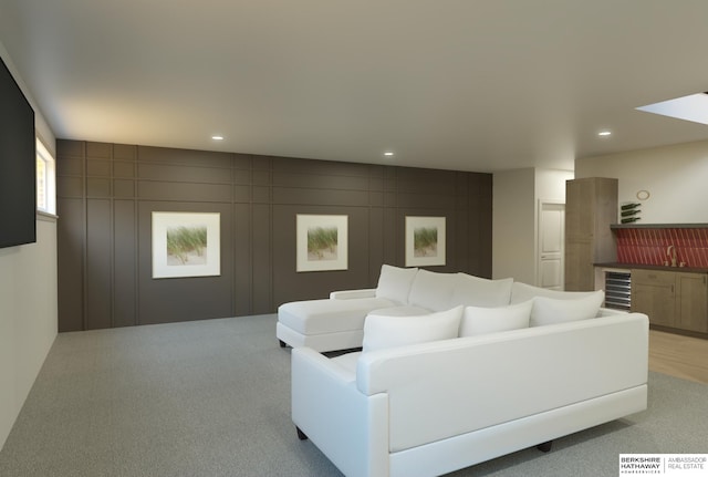 5518 S 200th Ave, Omaha, NE 68135 - living room with light carpet, recessed lighting, and beverage cooler
