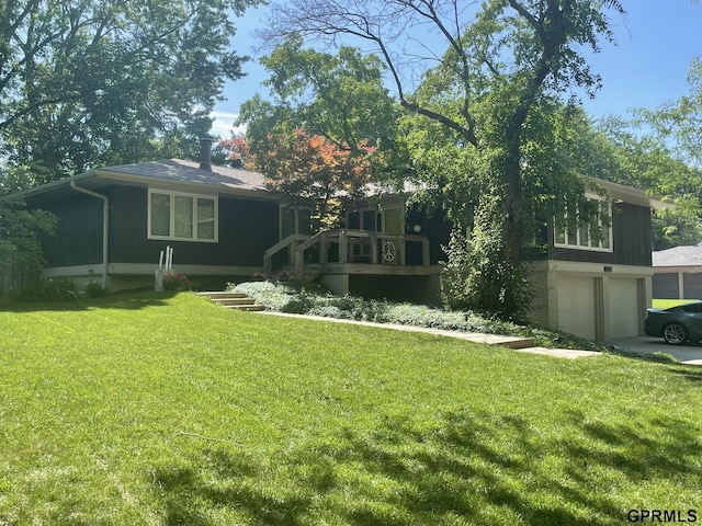 5833 Rolling Hills Blvd, Lincoln, NE 68512 - view of front facade with an attached garage, a front lawn, concrete driveway, and a wooden deck