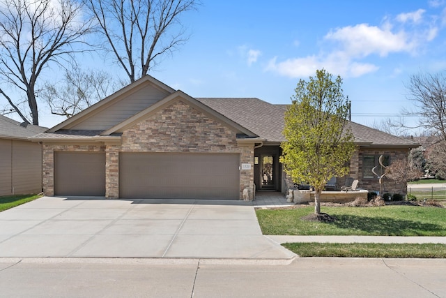 1320 S 190th Plz, Omaha, NE 68130 - view of front of home featuring an attached garage, driveway, a front lawn, a shingled roof, and stone siding