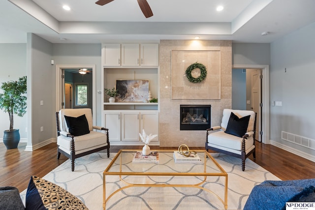 1320 S 190th Plz, Omaha, NE 68130 - living room with ceiling fan, wood finished floors, a tile fireplace, and recessed lighting