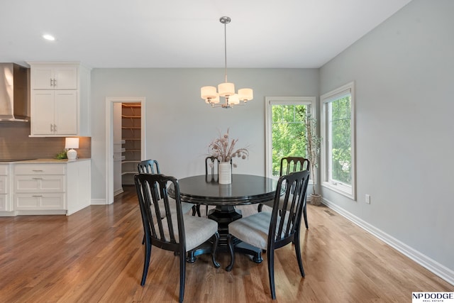 1320 S 190th Plz, Omaha, NE 68130 - dining space with light wood-style flooring, a chandelier, and recessed lighting