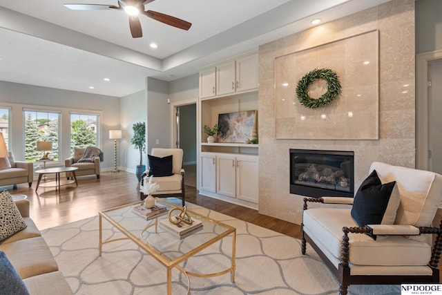 1320 S 190th Plz, Omaha, NE 68130 - living room with wood finished floors, ceiling fan, recessed lighting, and a fireplace