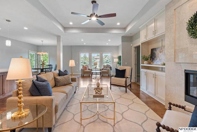 1320 S 190th Plz, Omaha, NE 68130 - living area with wood finished floors, ceiling fan, recessed lighting, and a tile fireplace