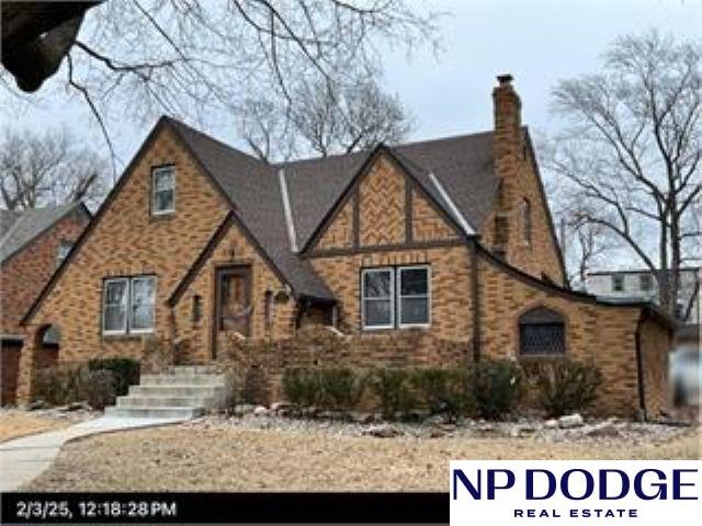2003 N 54th St, Omaha, NE 68104 - tudor home with a chimney