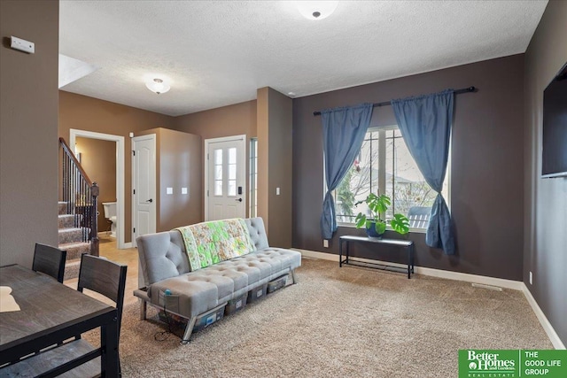 14611 S 24th St, Bellevue, NE 68123 - living area featuring stairway, a textured ceiling, and carpet flooring