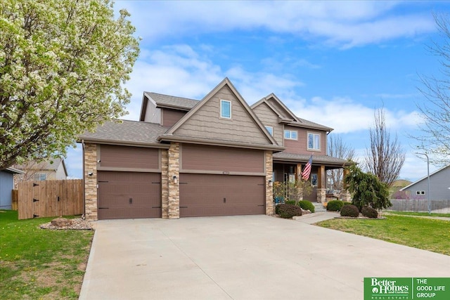 14611 S 24th St, Bellevue, NE 68123 - craftsman inspired home with a garage, a porch, driveway, stone siding, and roof with shingles