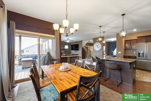 14611 S 24th St, Bellevue, NE 68123 - dining room featuring dark wood finished floors, plenty of natural light, a chandelier, and a ceiling fan
