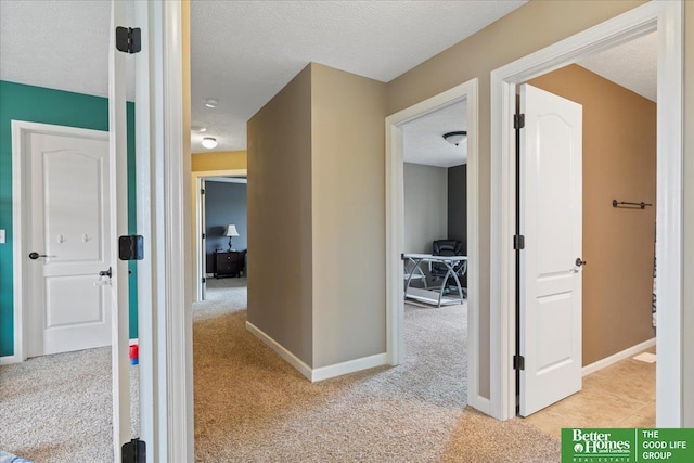 14611 S 24th St, Bellevue, NE 68123 - corridor featuring light carpet and a textured ceiling