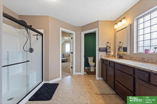 14611 S 24th St, Bellevue, NE 68123 - full bathroom with a stall shower, vanity, plenty of natural light, and a textured ceiling