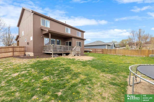 14611 S 24th St, Bellevue, NE 68123 - rear view of house featuring a trampoline, a deck, and a fenced backyard