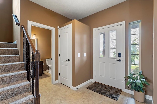 14611 S 24th St, Bellevue, NE 68123 - entrance foyer featuring stairs and light tile patterned flooring