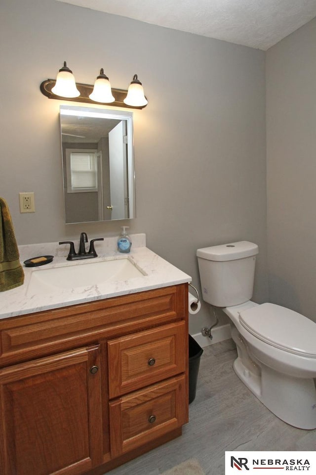4300 N St, Lincoln, NE 68510 - half bath featuring vanity and wood finished floors