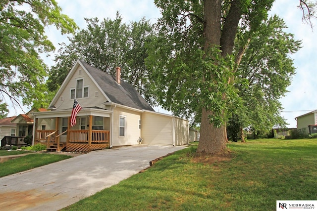 4300 N St, Lincoln, NE 68510 - view of front of property with driveway, a chimney, a porch, and a front yard