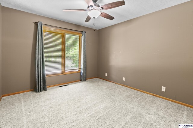 16367 Y St, Omaha, NE 68135 - carpeted spare room featuring baseboards and a ceiling fan
