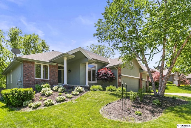 16367 Y St, Omaha, NE 68135 - view of front facade featuring brick siding, an attached garage, a front lawn, and driveway