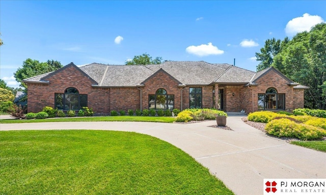 733 N 157th Cir, Omaha, NE 68118 - view of front of property with a front yard and brick siding