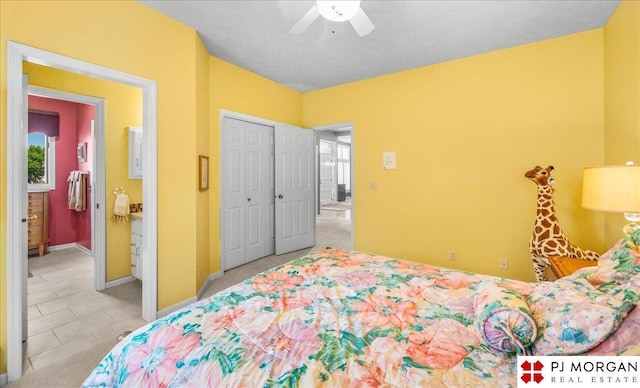 733 N 157th Cir, Omaha, NE 68118 - bedroom with a closet, connected bathroom, and ceiling fan