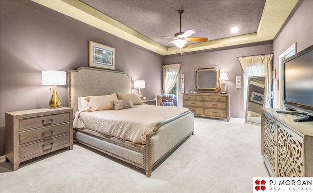 733 N 157th Cir, Omaha, NE 68118 - bedroom with a raised ceiling, light colored carpet, a textured ceiling, and a ceiling fan