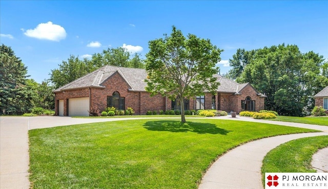 733 N 157th Cir, Omaha, NE 68118 - view of front of property with brick siding, a front yard, concrete driveway, and an attached garage