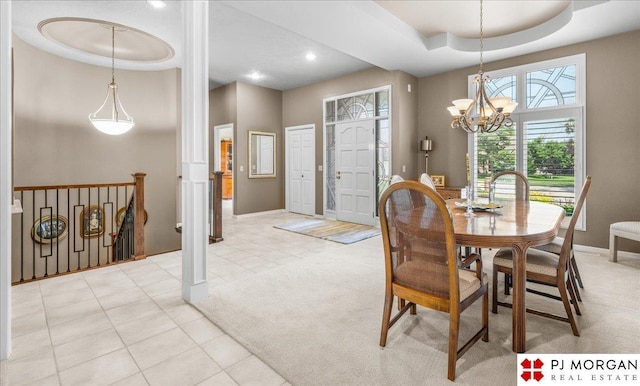 733 N 157th Cir, Omaha, NE 68118 - dining area featuring a raised ceiling, light carpet, a chandelier, light tile patterned floors, and recessed lighting