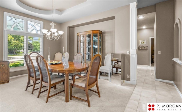 733 N 157th Cir, Omaha, NE 68118 - dining room with a chandelier, light tile patterned floors, light carpet, a raised ceiling, and recessed lighting