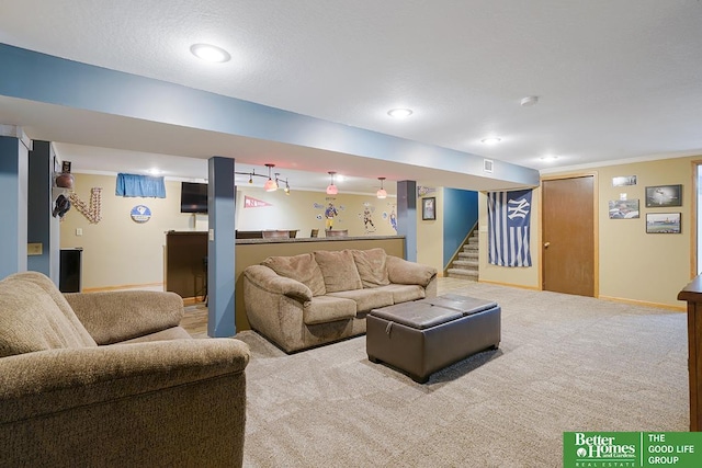 1800 N Clarmar Ave, Fremont, NE 68025 - living room featuring carpet, stairs, bar, and ornamental molding