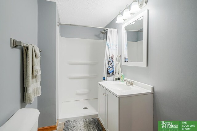 1800 N Clarmar Ave, Fremont, NE 68025 - full bathroom with vanity and a shower with shower curtain