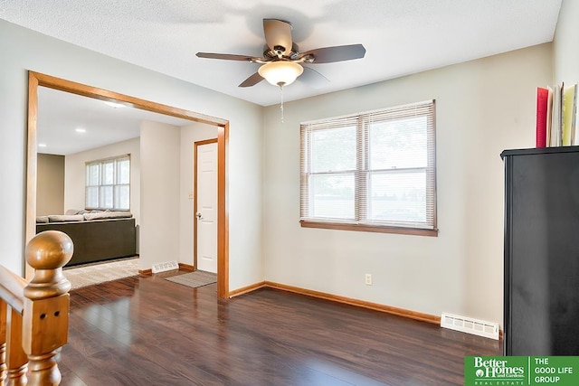 1800 N Clarmar Ave, Fremont, NE 68025 - unfurnished room with dark wood-style floors and ceiling fan