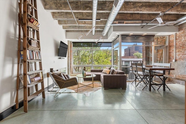 1502 Jones St Unit 208, Omaha, NE 68102 - living area with finished concrete floors and a high ceiling