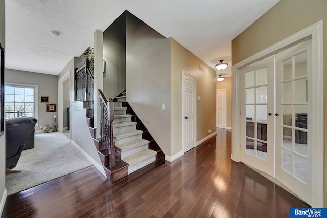 5441 S 88th St, Lincoln, NE 68526 - entryway featuring french doors, stairs, and wood finished floors